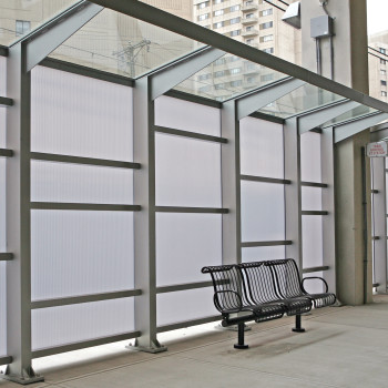 Sloped: 7/16” Clear HS Laminated; Vertical 16mm Opal Cellular Polycarbonate